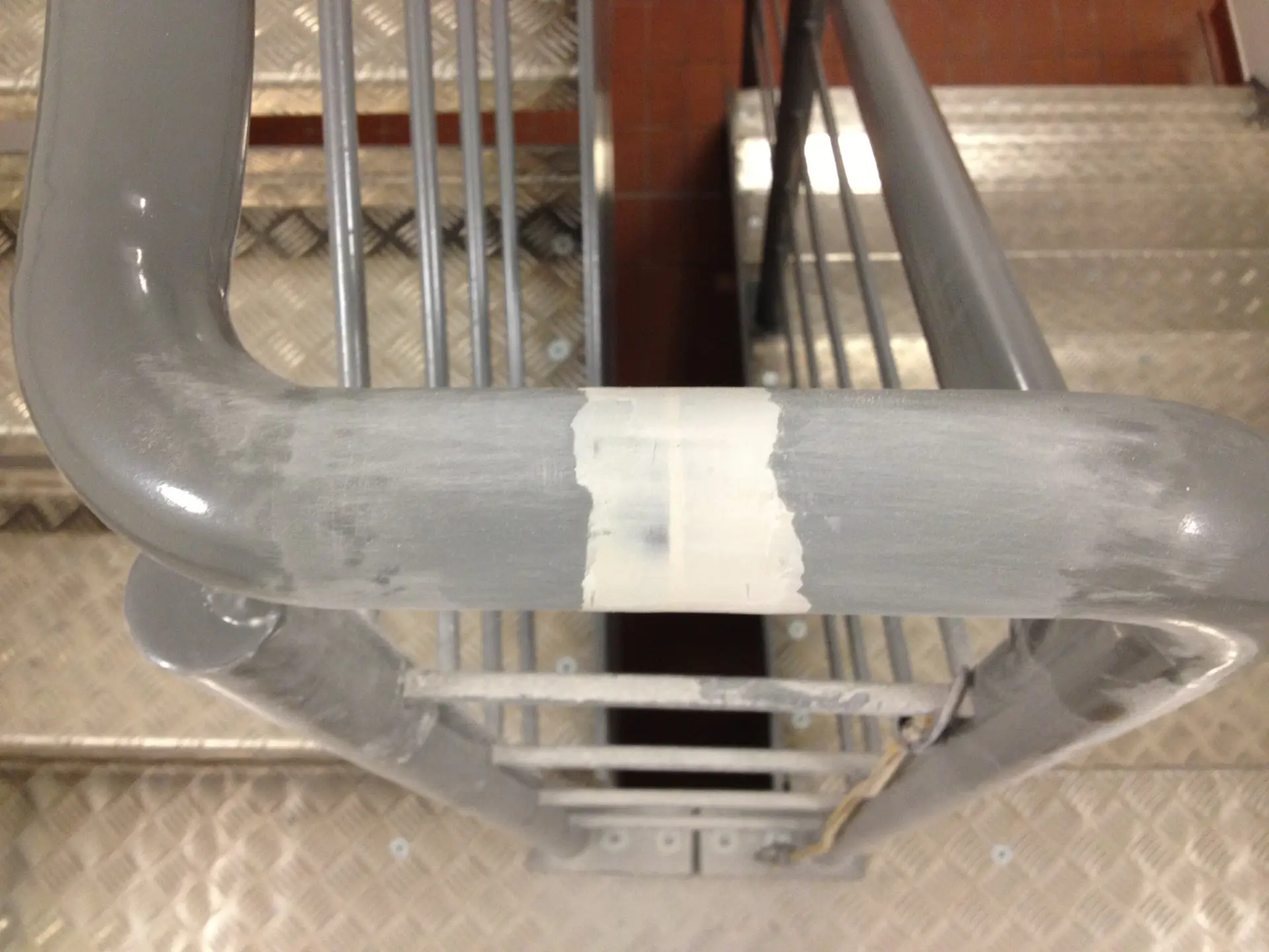 Metal handrail before being sprayed